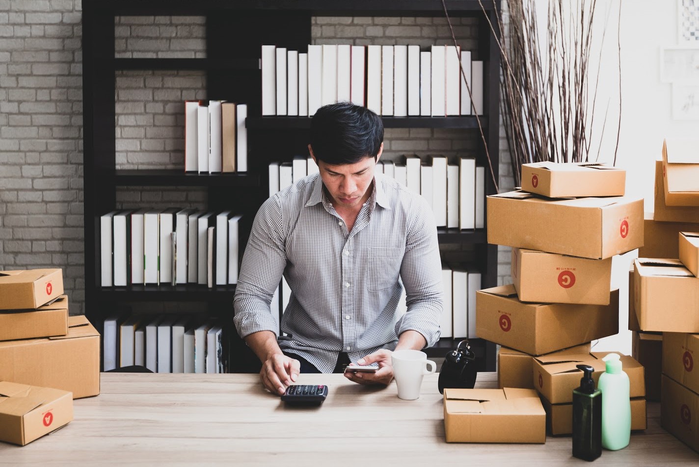 Man working with cardboard packaging.jpg